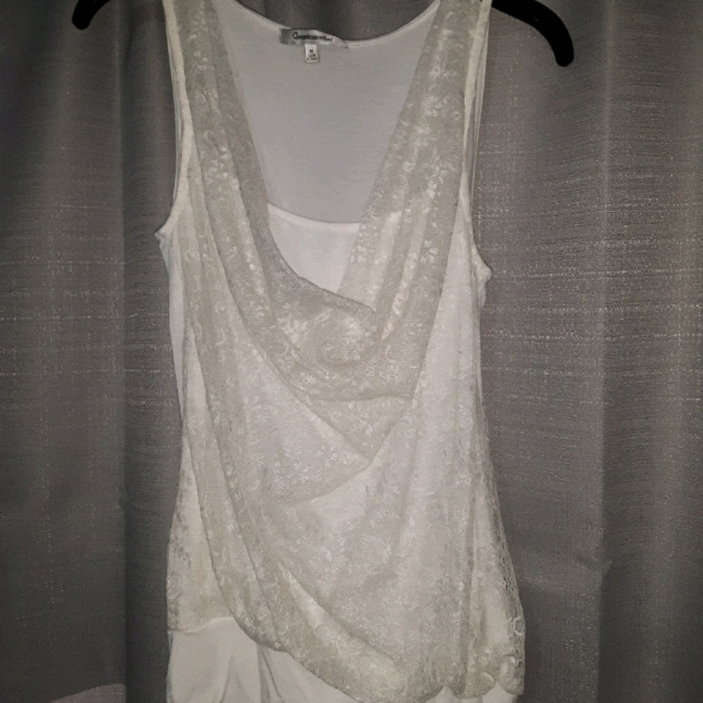 Women's sleeveless top. Front lace draped neckline
